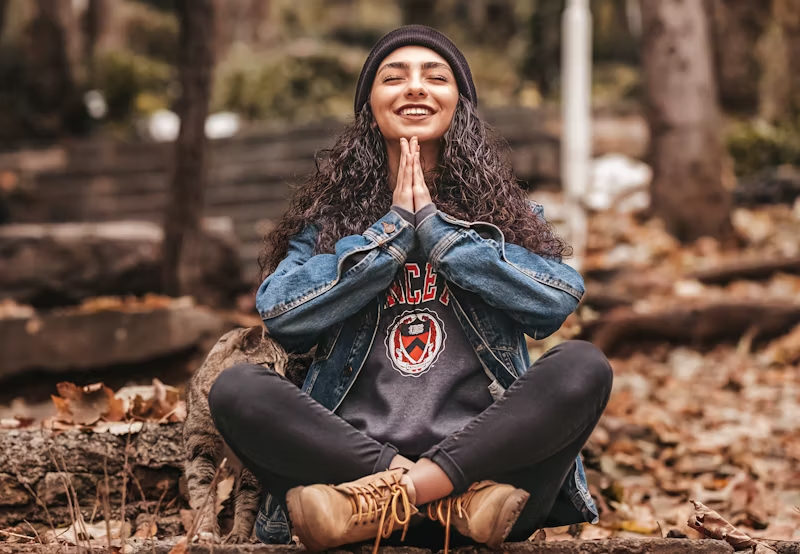 a woman in the woods meditating