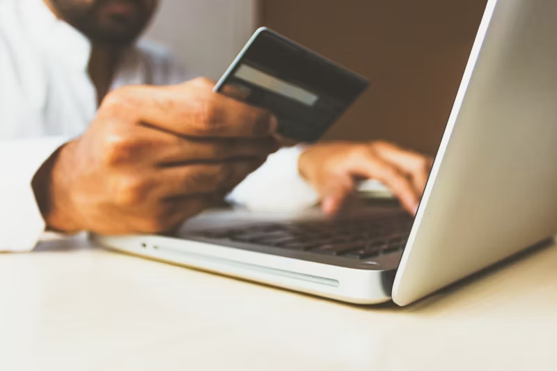 a man putting in his credit card details online