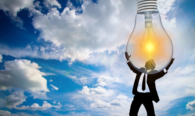 man holding lightbulb