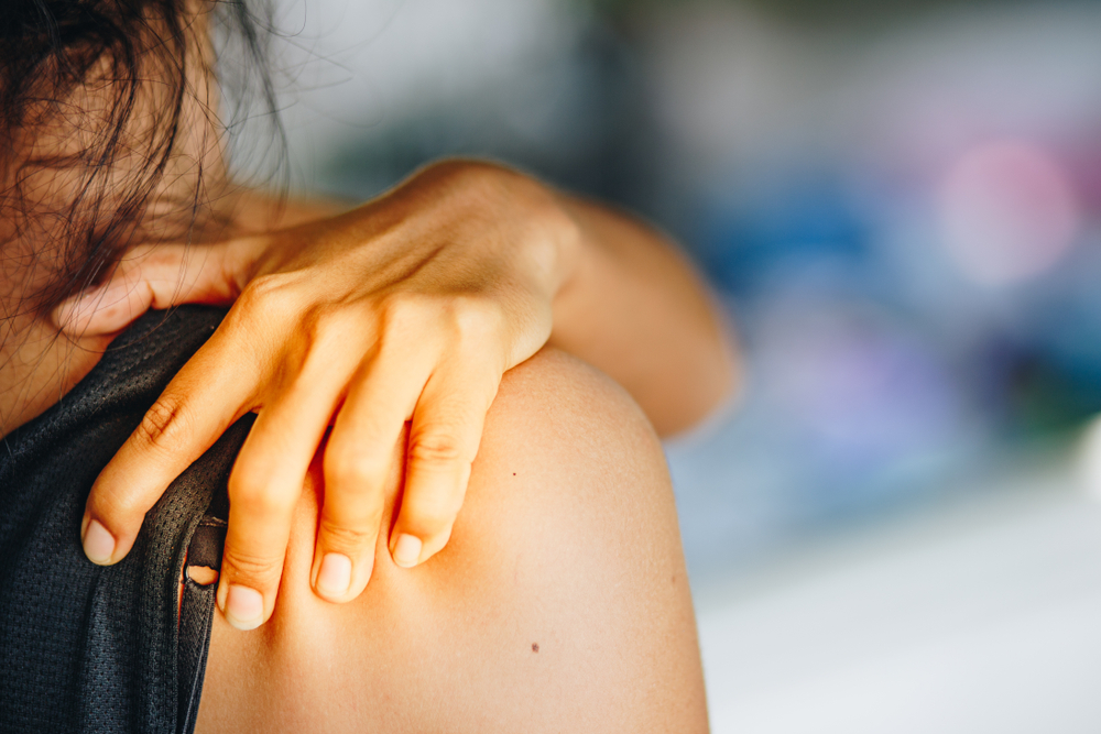 Young woman pain right shoulder,health care concept