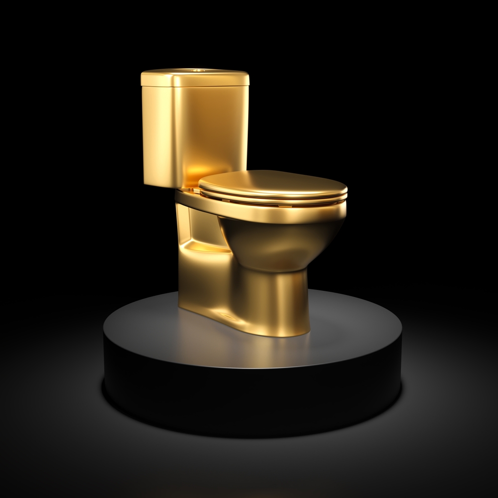 gold metal toilet bowl on black pedestal, dark background. 3d render
