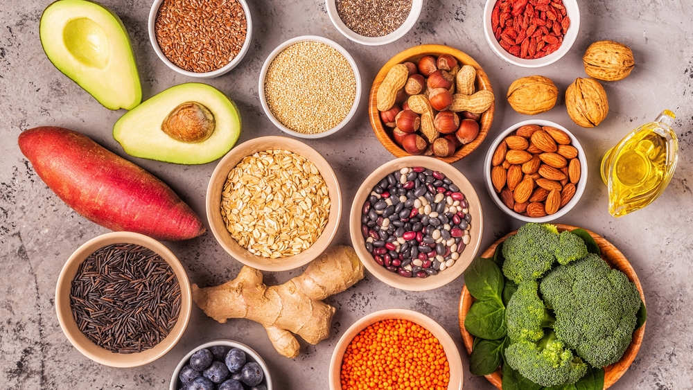 Superfoods on gray concrete background. Healthy food clean eating concept. Top view.