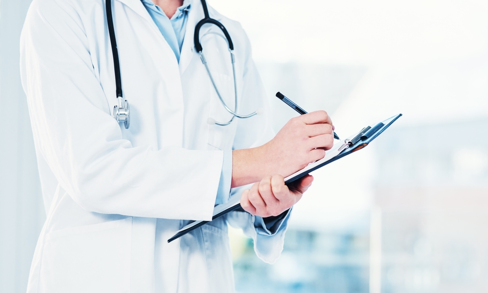 Hands, doctor and clipboard writing notes for hospital schedule, history record or healthcare checklist. Paper, documents or person with life insurance with medical aid, prescription or test results

