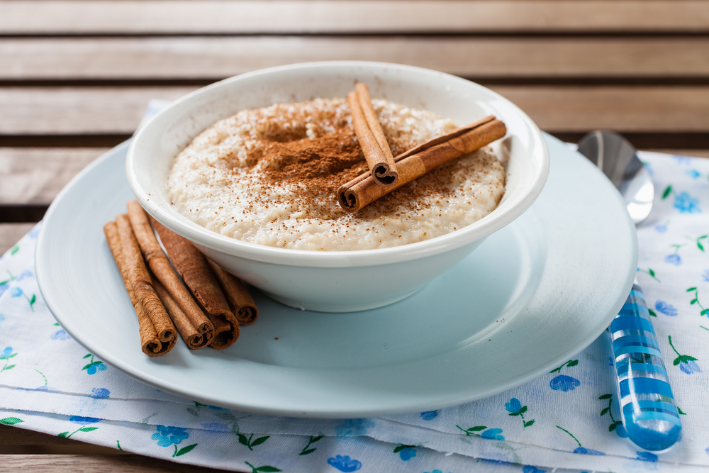 porridge with cinnamon in a bowl on a table, selective focus
