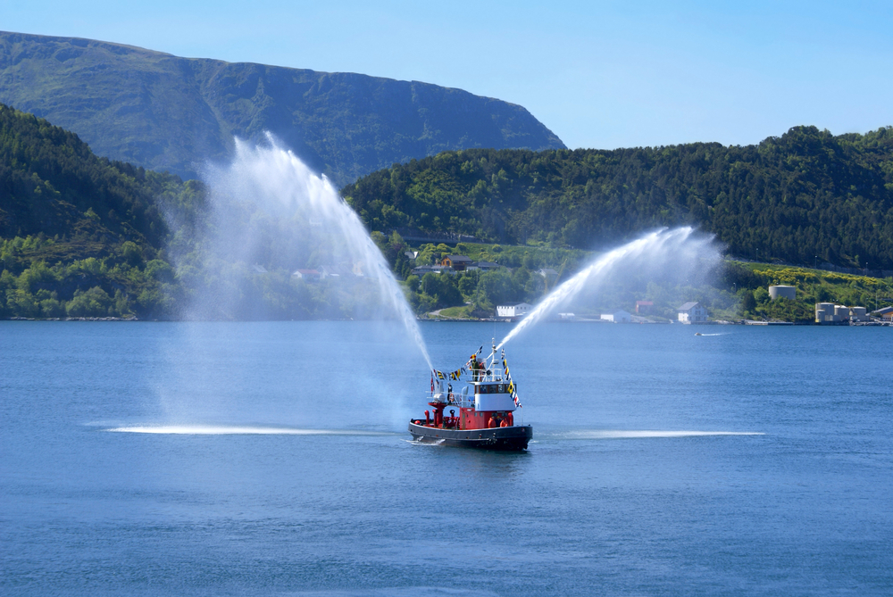 Traditional Norwegian Fire Boat at the port of Alesund. This is typically seen escorting cruise ships in and out of the Harbor.
