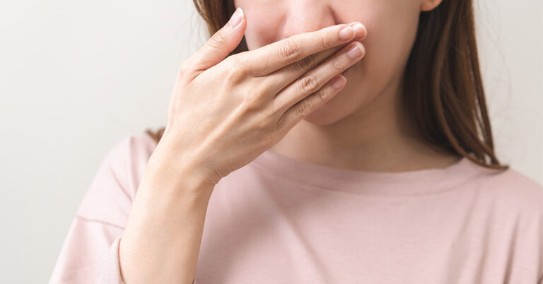 What causes bad breath and how do you get rid of it? - Featured image