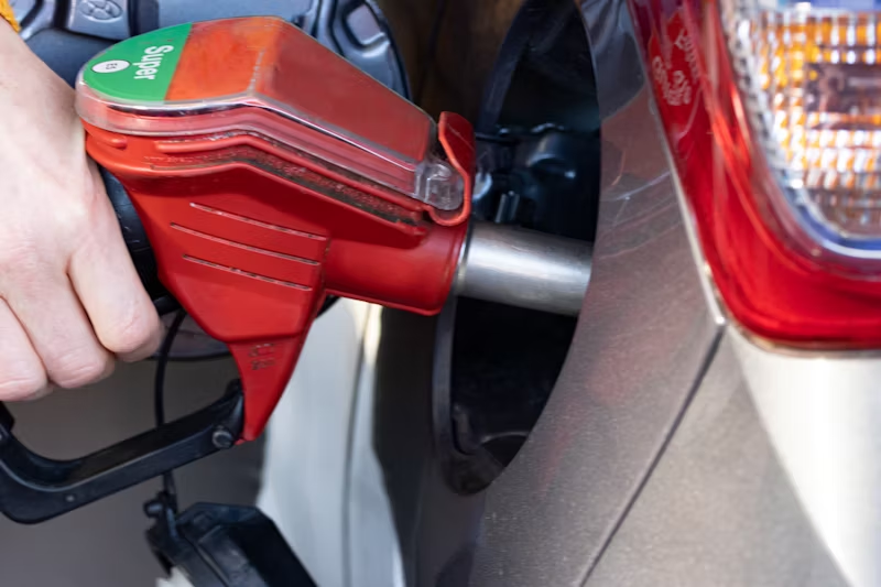 person filling their car with gas
