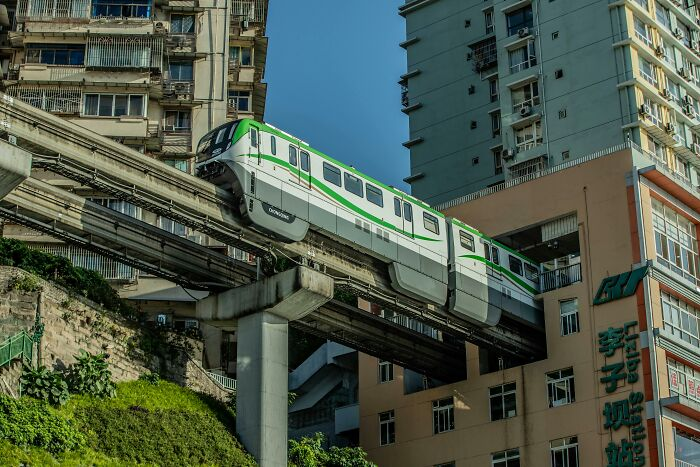 a subway car going right through a building