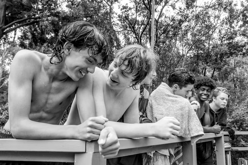 black and white photo of kids hanging ou