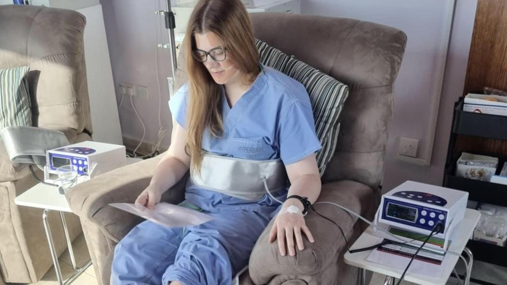 Emily Norton receiving treatment