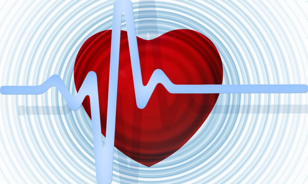 a heartbeat with a heart and loud waves coming off of it