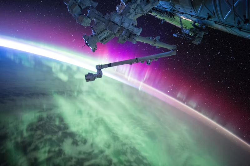 The ISS over Earth's Aurora Borealis