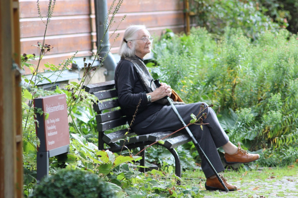 an older woman sitting on her own