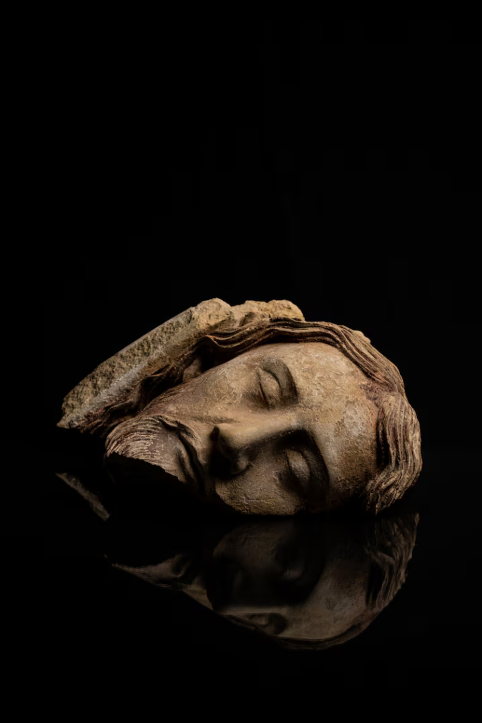 A portion of a sculpture of Jesus — one of more than a thousand fragments of art not seen in hundreds of years.