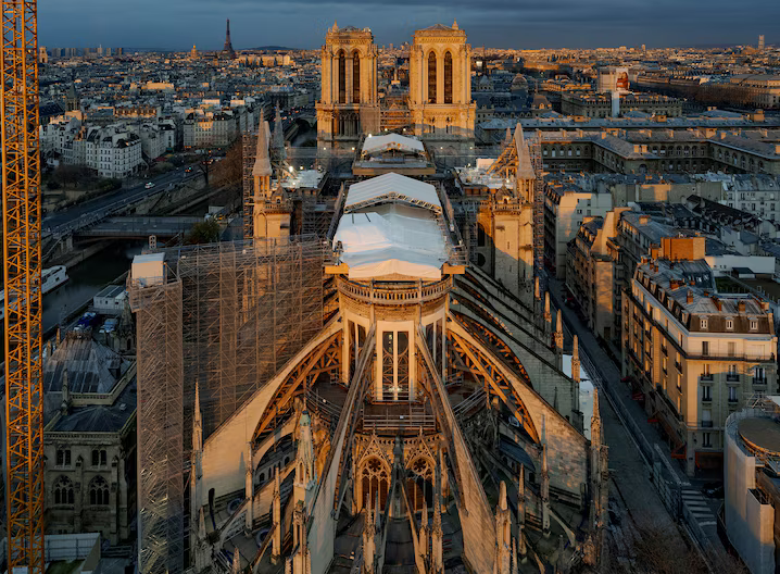 Scaffolding and white tarps on Notre-Dame for restoration after the 2019 fire.