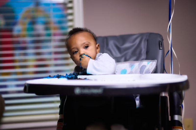 a toddler in a baby seat
