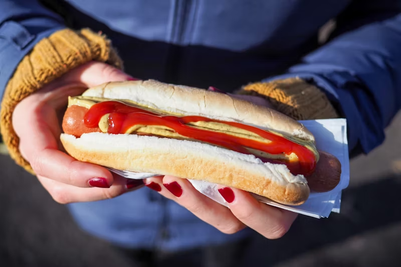 ketchup and mustard on a hot dog