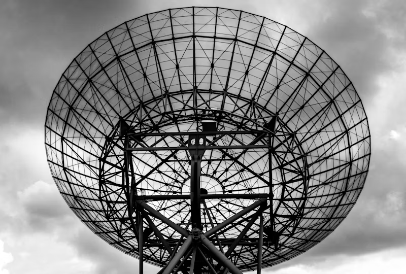 black and white photo of a large land satellite