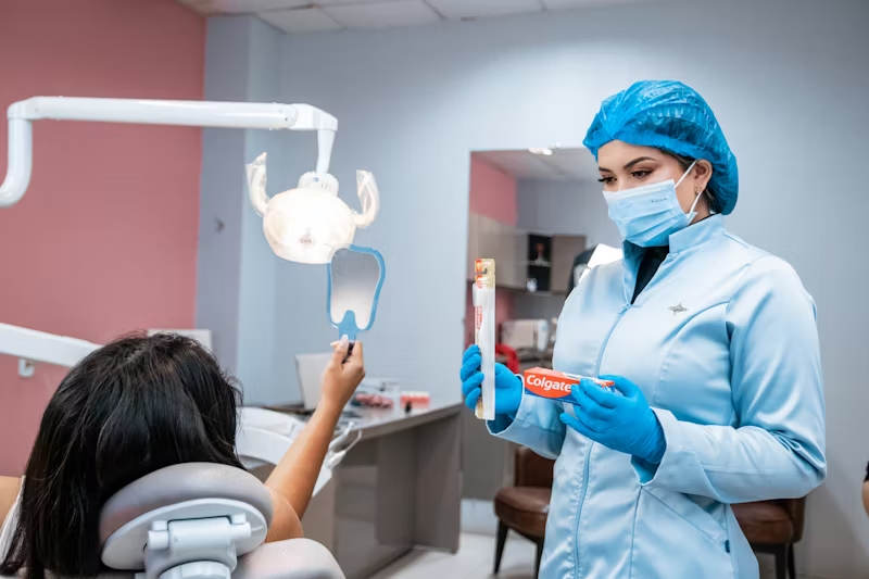 a dentist and patient speaking to each other