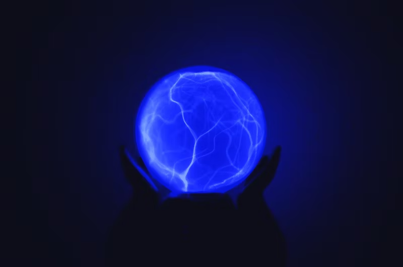 hands holding an electric ball