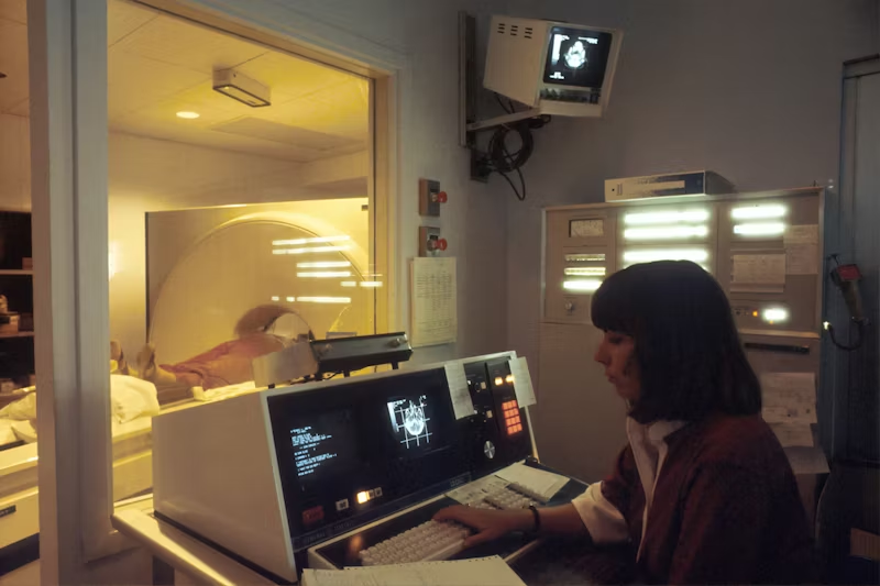 a woman reviewing medical imaging
