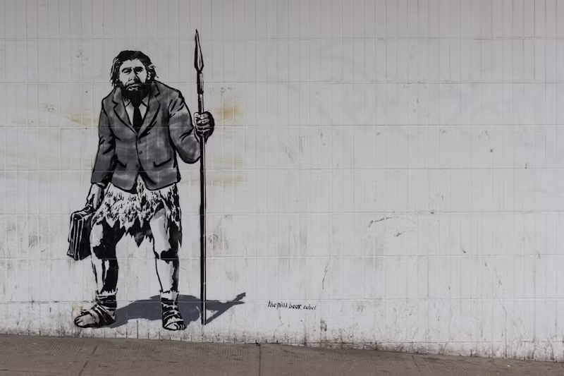 graffiti of a neanderthal in a business suit