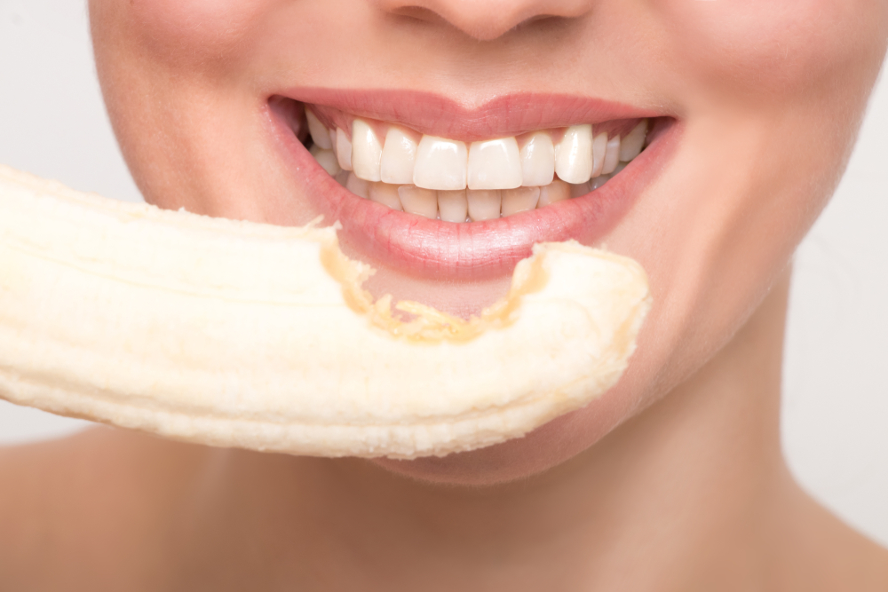 Beautiful woman with bananas in her hands
