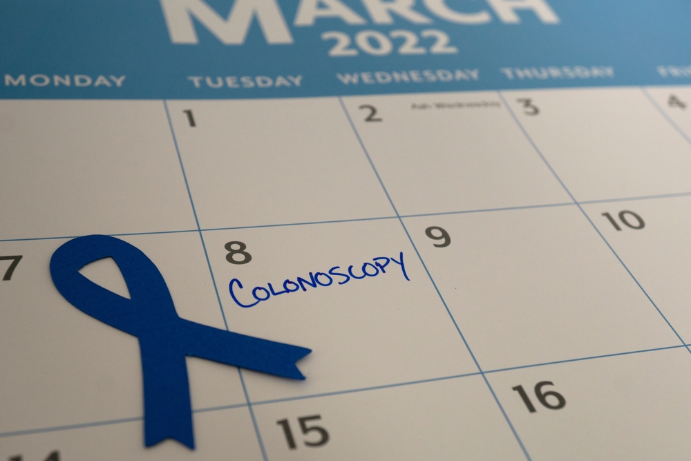 Calendar reminder for colonoscopy appointment in March, which is Colon Cancer Awareness month. The blue ribbon represents the month.
