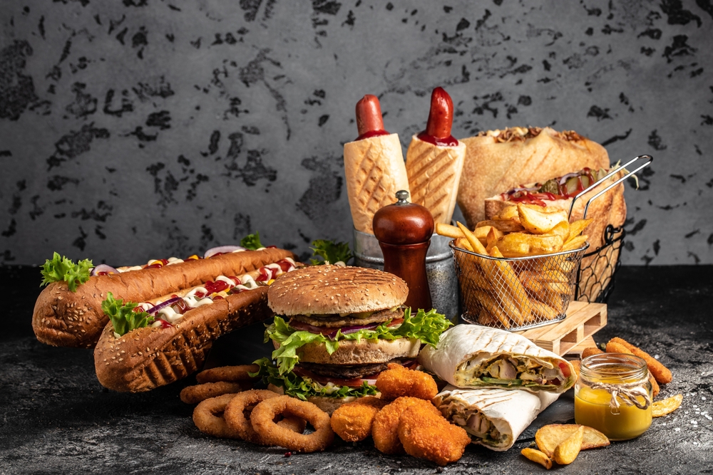 take away fast food products Kebab, pita, gyros, shaurma, wrap sandwich with french fries and nuggets meal, junk food and unhealthy food. banner, menu, recipe place for text.