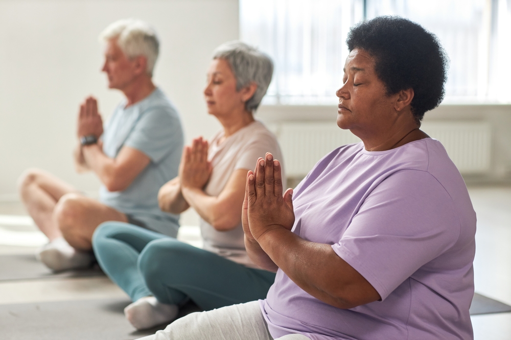 People meditating in lotus position