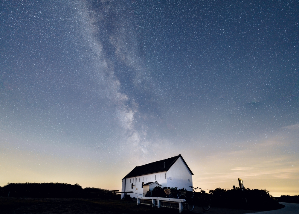 The Milky way above house in nature on the Island Spiekeroog in Germany
