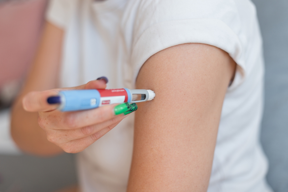 fat girl injects the drug Ozempic into her arm for weight loss at home. Weight loss and treatment without sports
