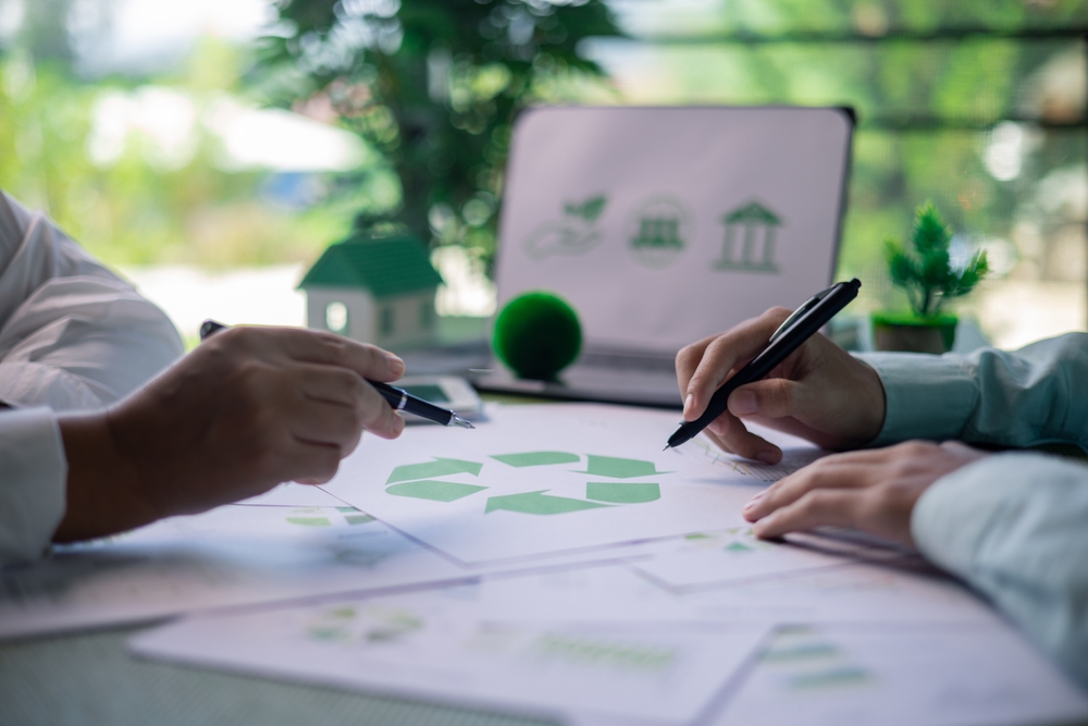 Business meeting on sustainable real estate development. real estate, sustainable development, business meeting, green building, eco-friendly, architecture, planning, construction, investment.