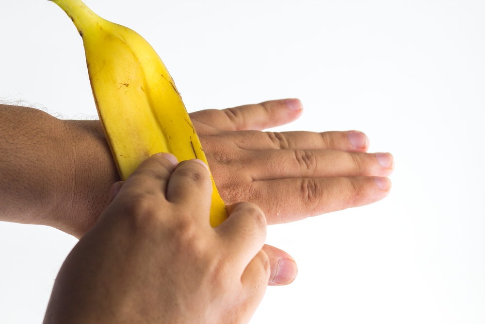 Using a banana peel on hand skin
