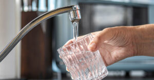 Glass being filled with tap water