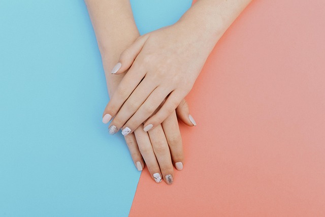 Hands on a blue and pink background