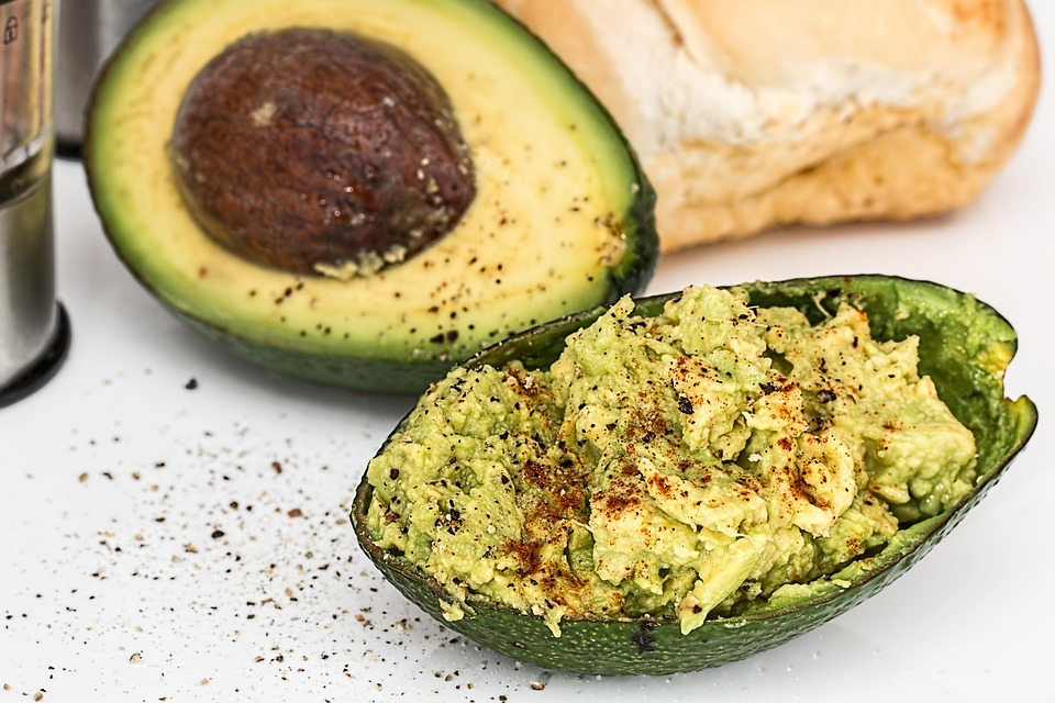 A delicious combination of avocado on toasted bread, garnished with spices, representing a nutritious meal option.