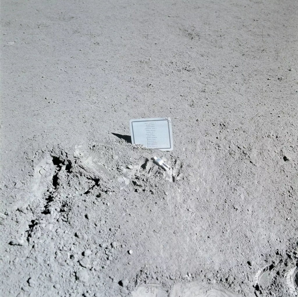 The plaque remembers 14 astronauts