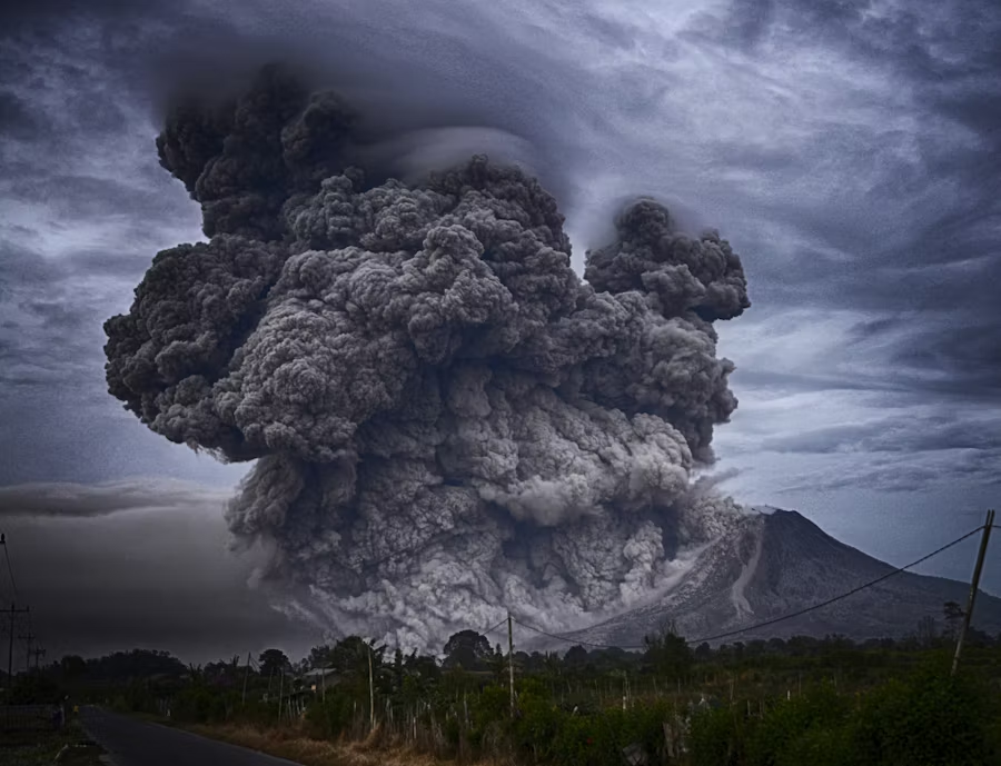 volcanic eruption with a plume of ash