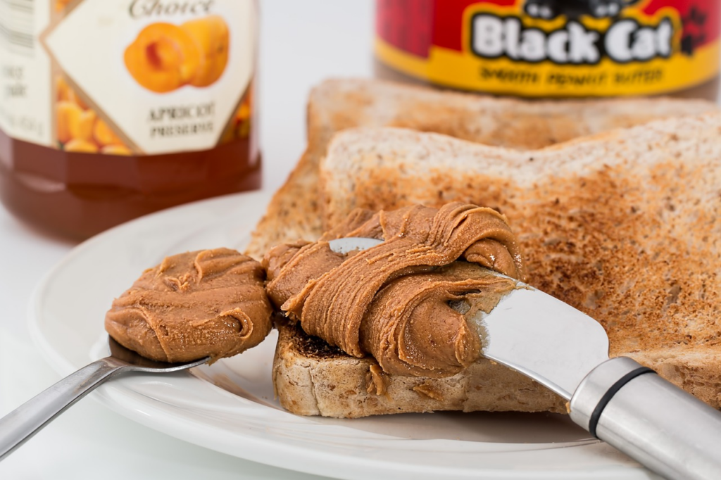 Peanut butter - high in omega 6 - being spread on toast