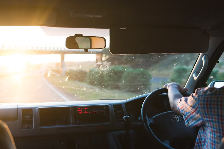 a person driving and looking through the windshield