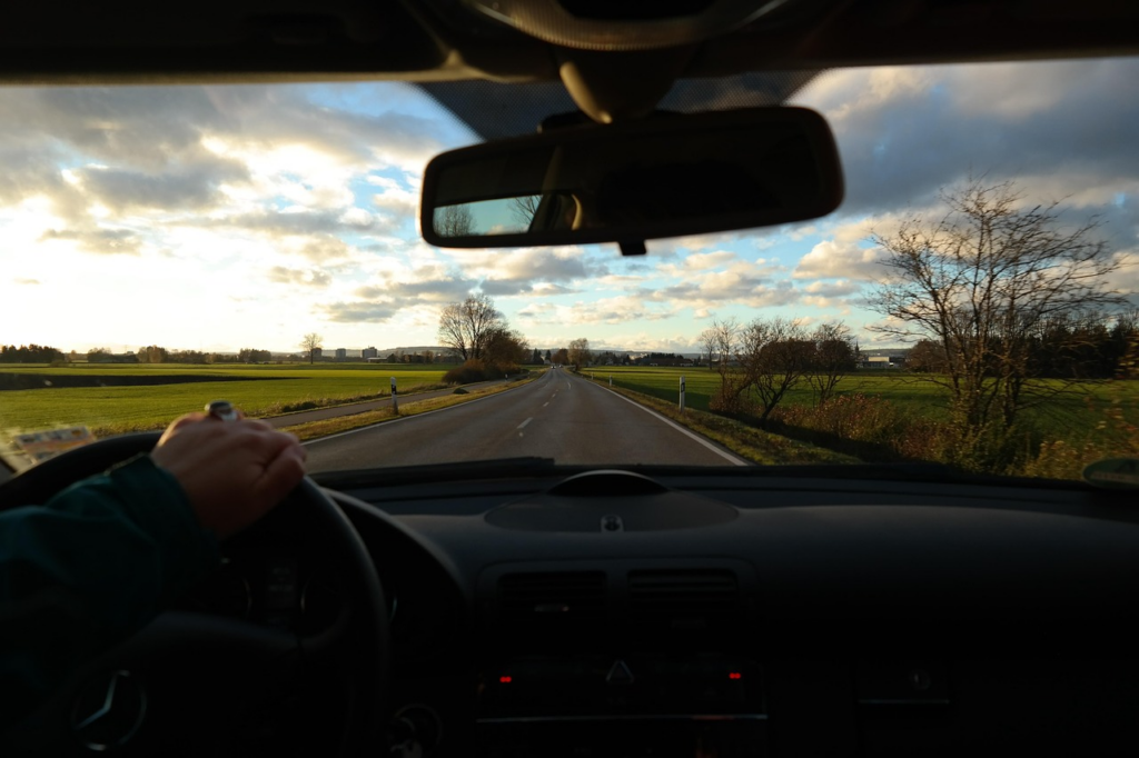 a person driving in their car