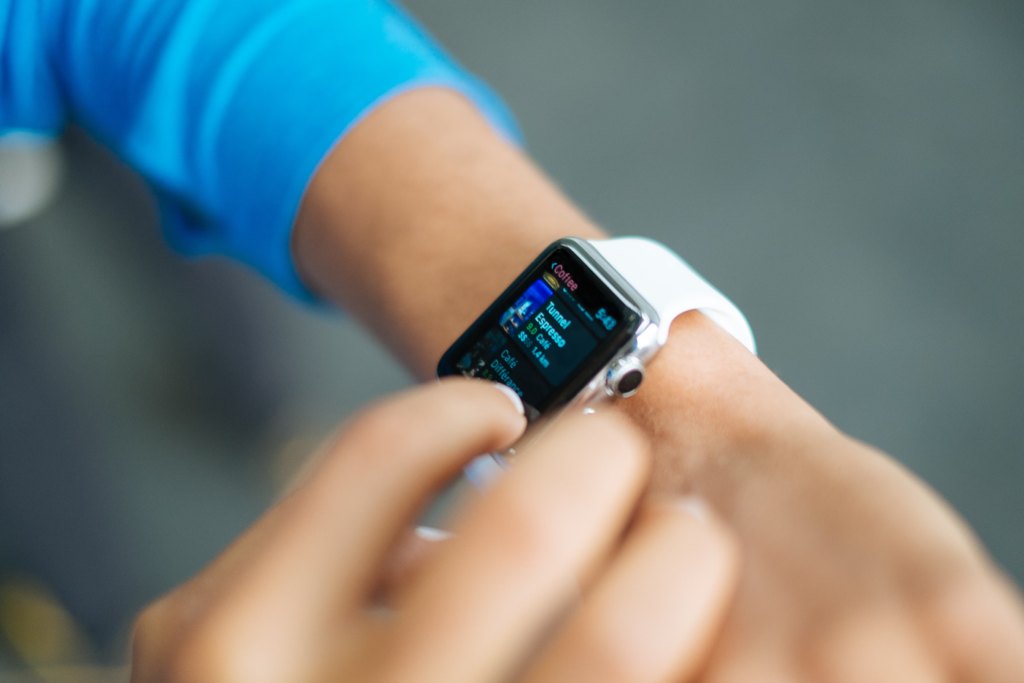 A person holds an Apple Watch, symbolizing technology's role in dementia research and monitoring health.