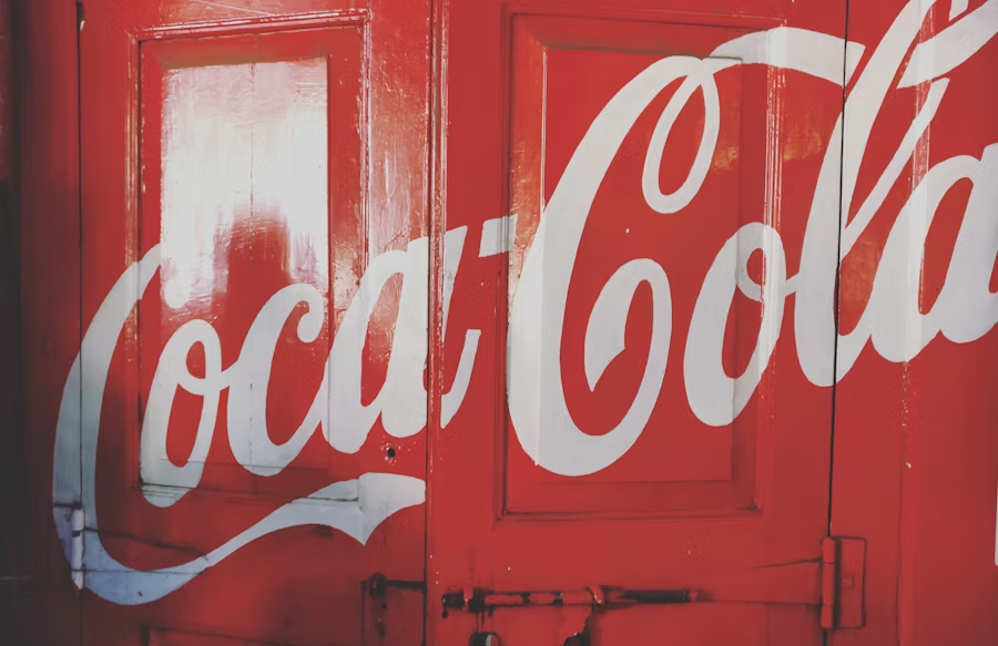 Coca-Cola written on a red door