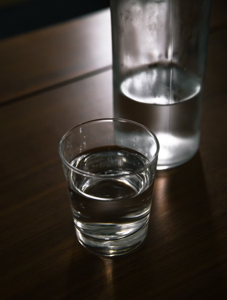 a glass of water on a countertop