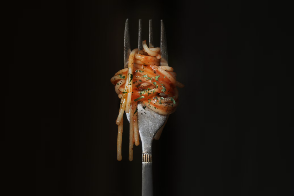A fork with spaghetti and meat, representing the erratic changes in appetite caused by depression.