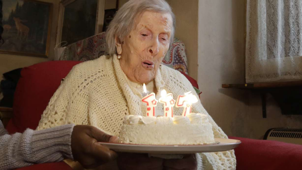 Emma Morano blowing out birthday candles on her 117 birthday