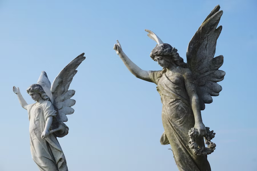 statues of angels looking down