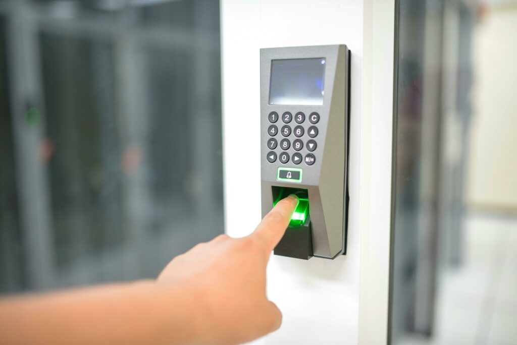 human hand presenting finger to a biometric system