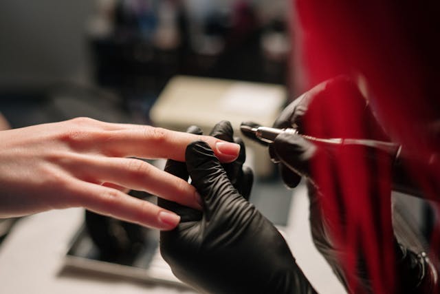 person working on a nail